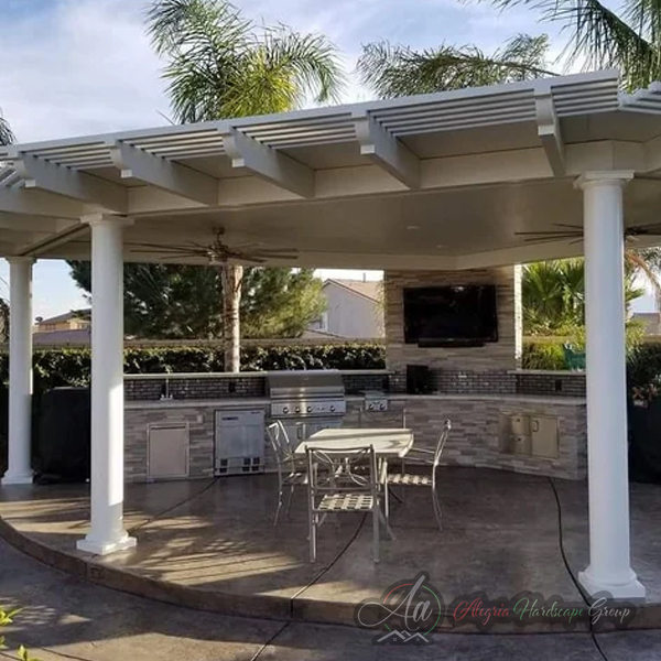 Outdoor kitchen and living area by Alegria Hardscape Group